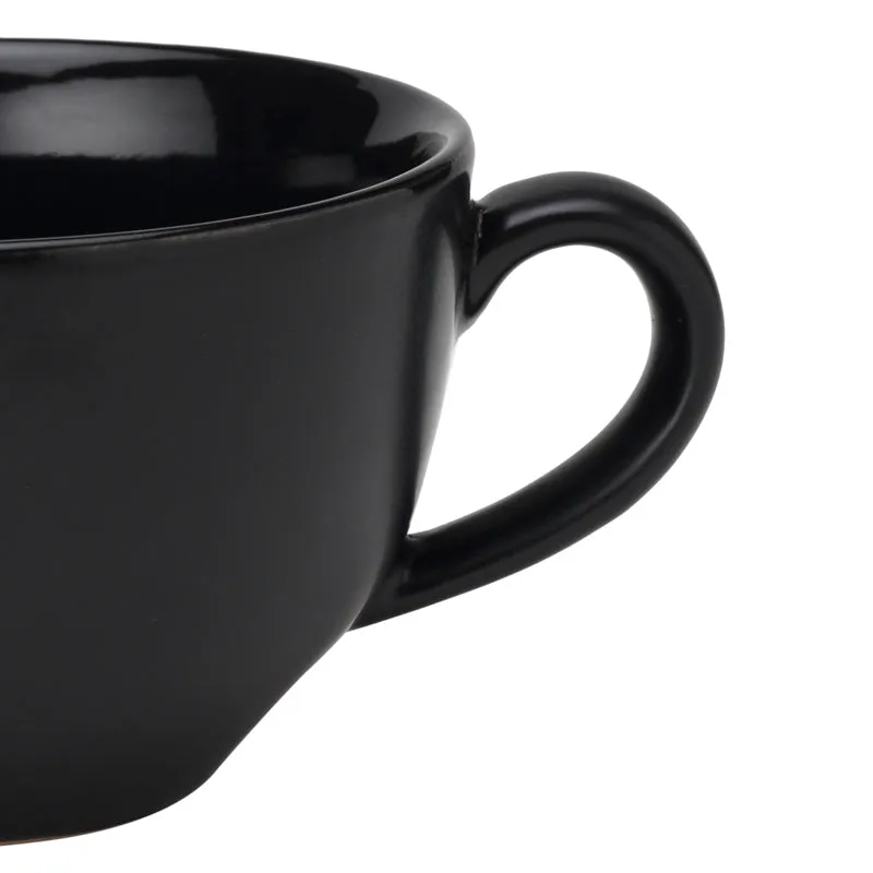 Black ceramic mug with a curved handle shown in close-up