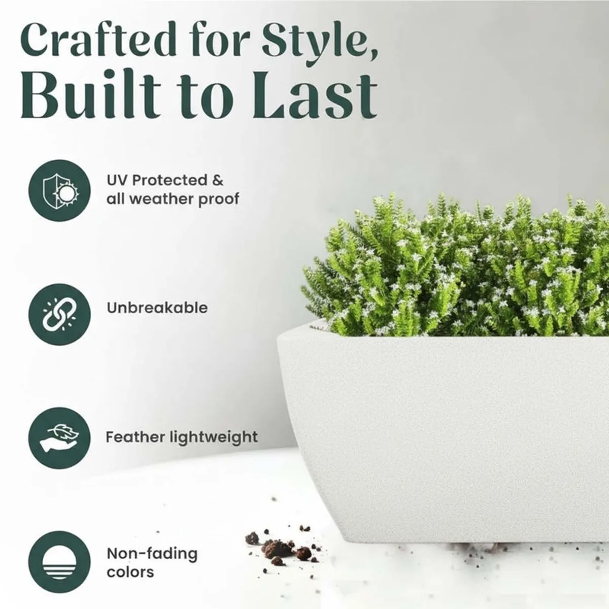White rectangular planter with green foliage in an outdoor setting.