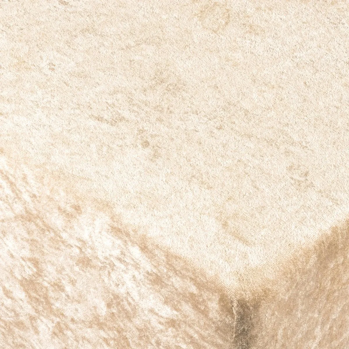 Close-up of beige textured upholstery on ottoman