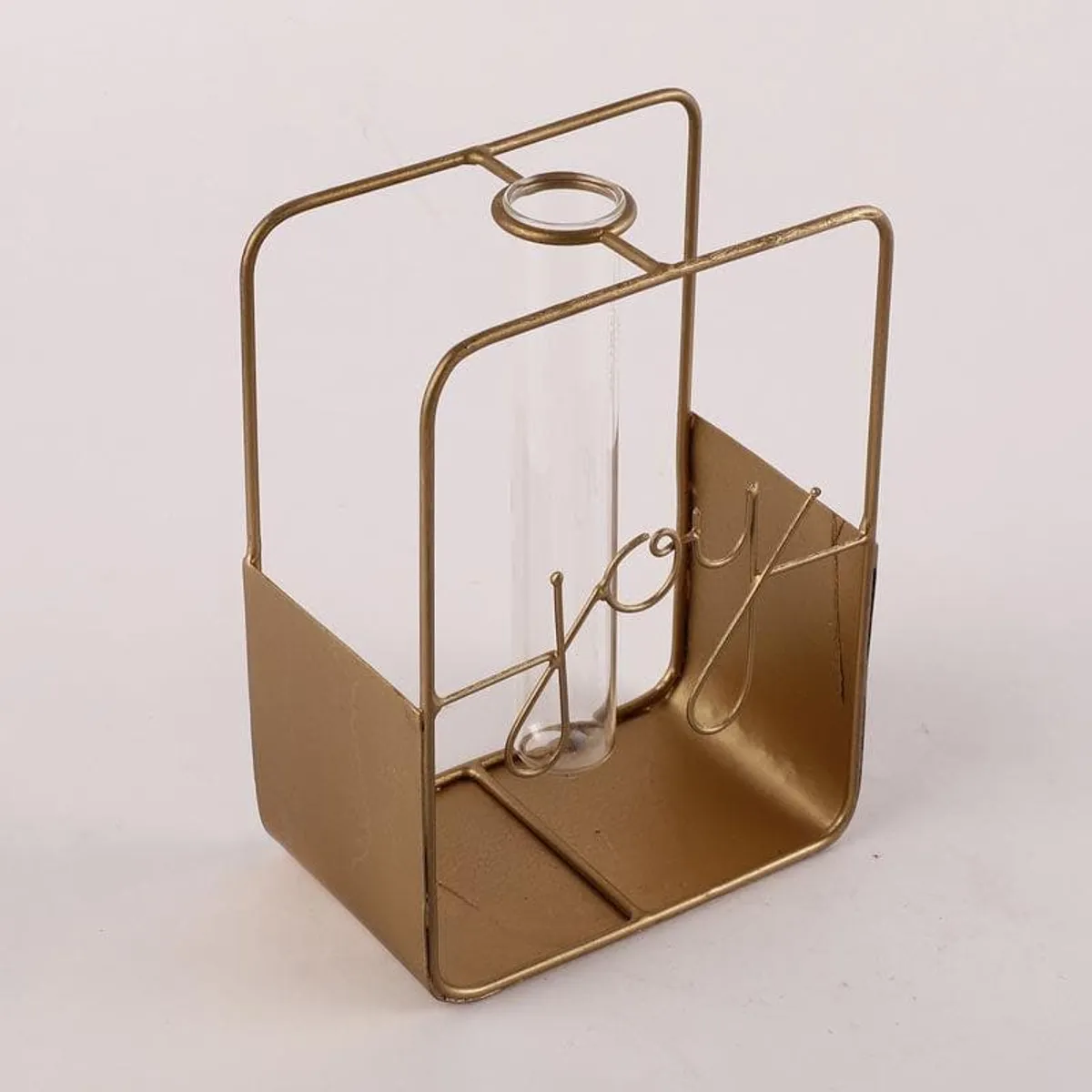 Angled view of gold-toned testube planter with joy wire detail