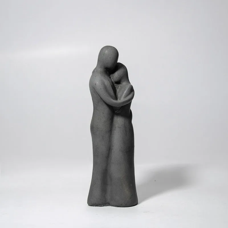 Front view of a grey abstract figurine showpiece on a plain background