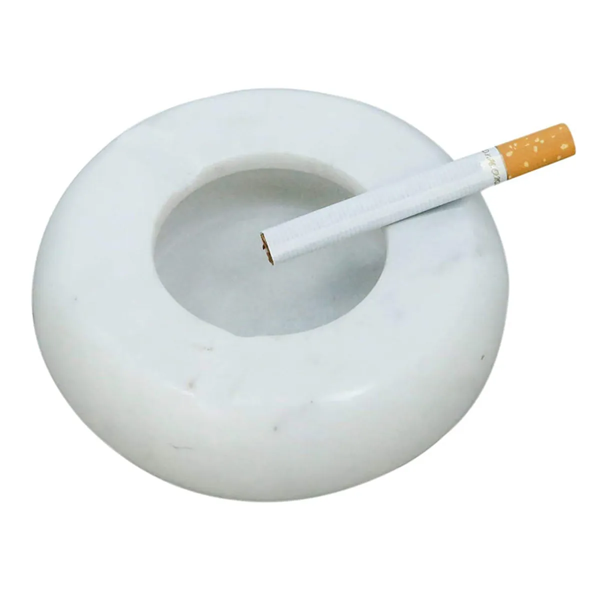 White marble ash tray shown with a cigarette resting across it