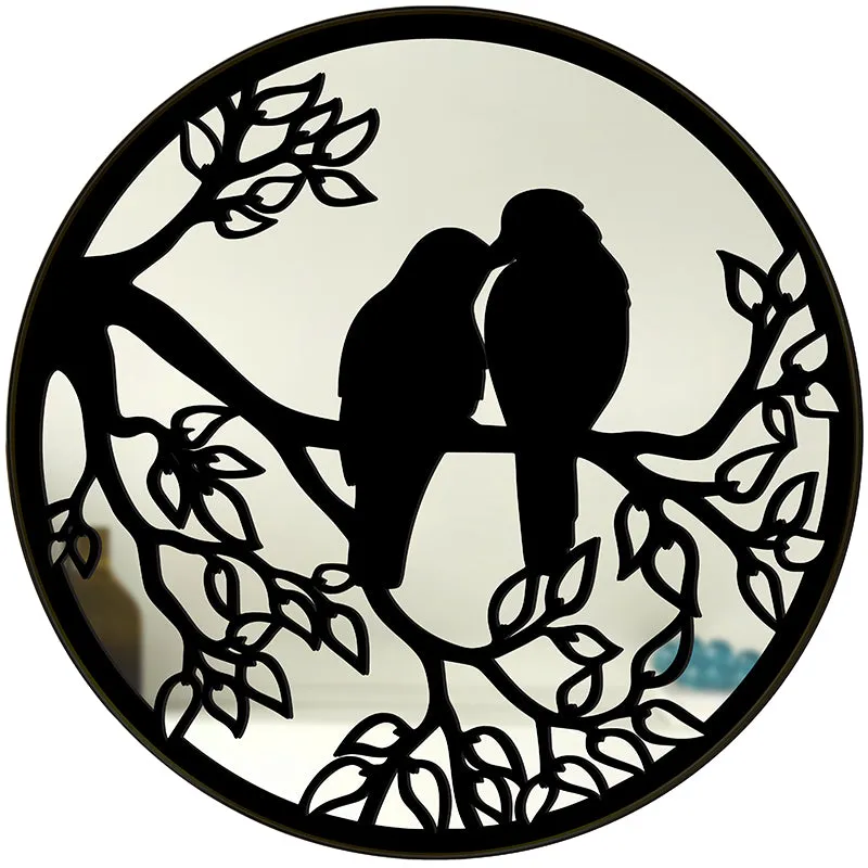 Front view of round mirror with two birds and branch design