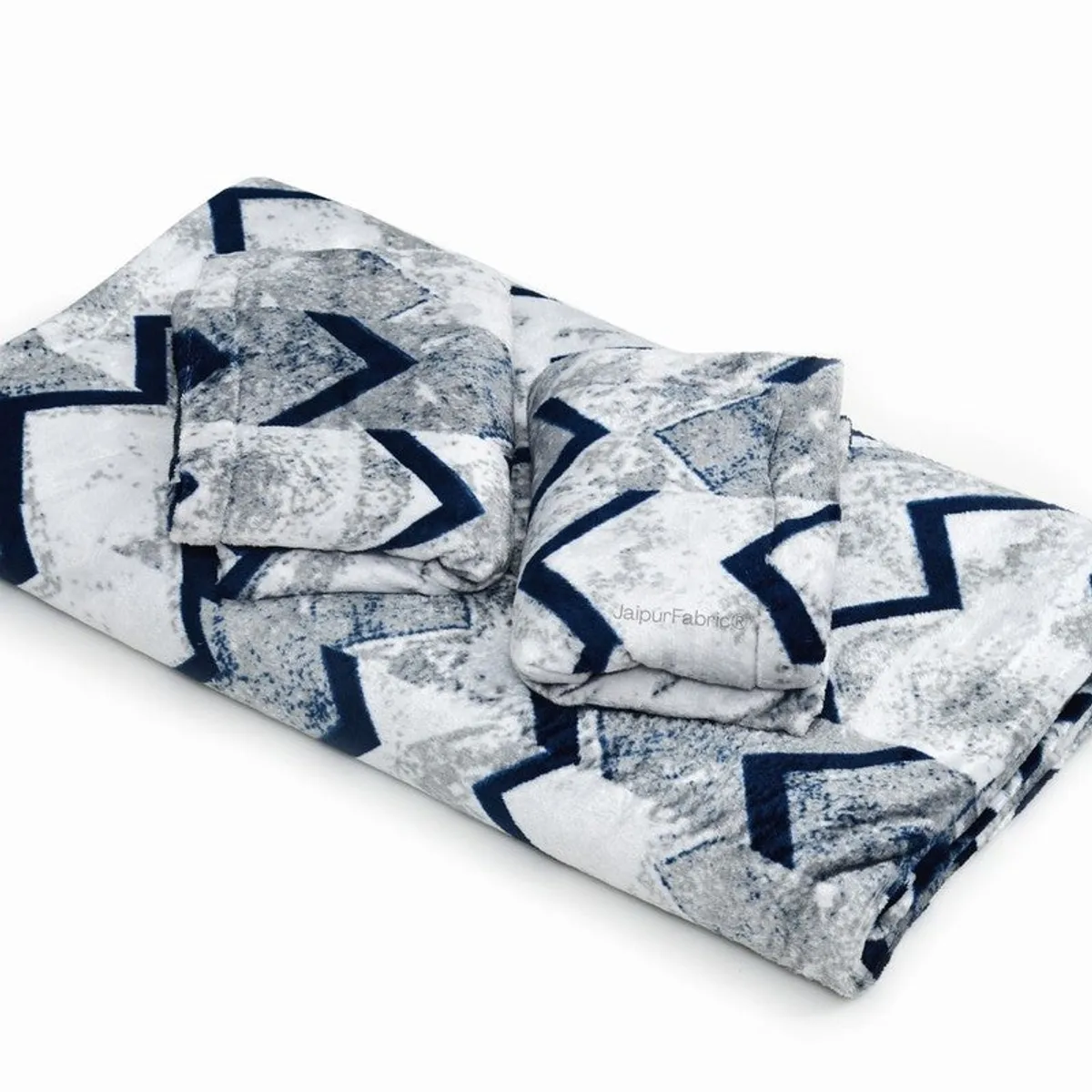 Folded blue and white patterned woolen bedsheet