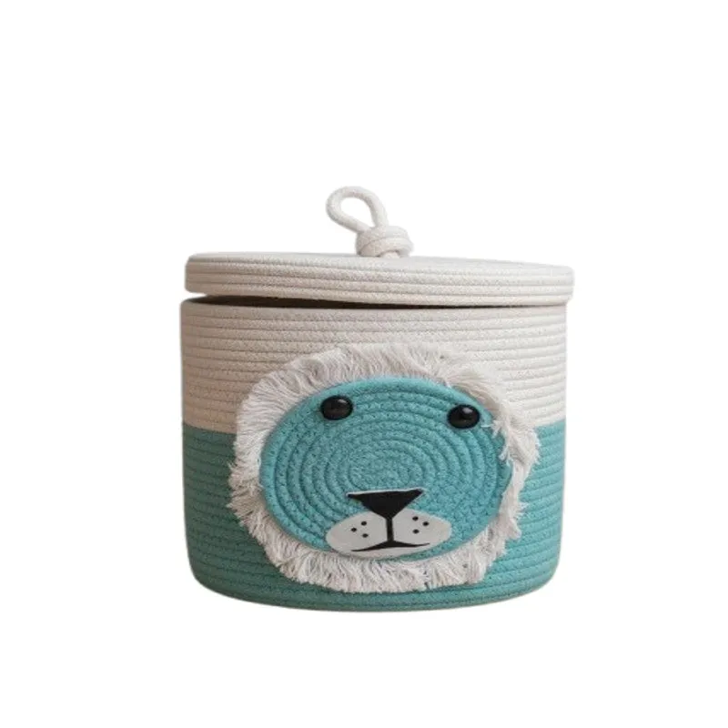Blue and white cylindrical cotton basket with lion face and lid