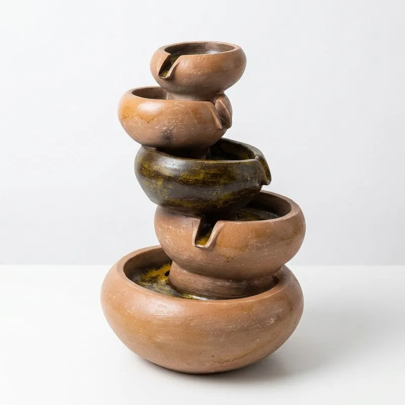 Studio view of brown cascading fountain with tiered bowls
