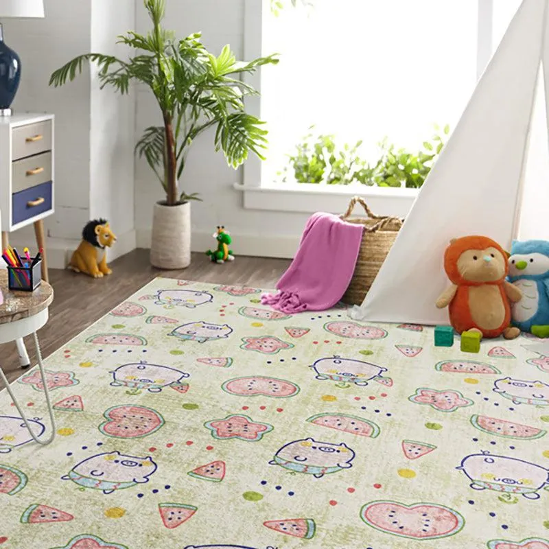 Kids carpet in a room with pig and watermelon motifs on a light green base