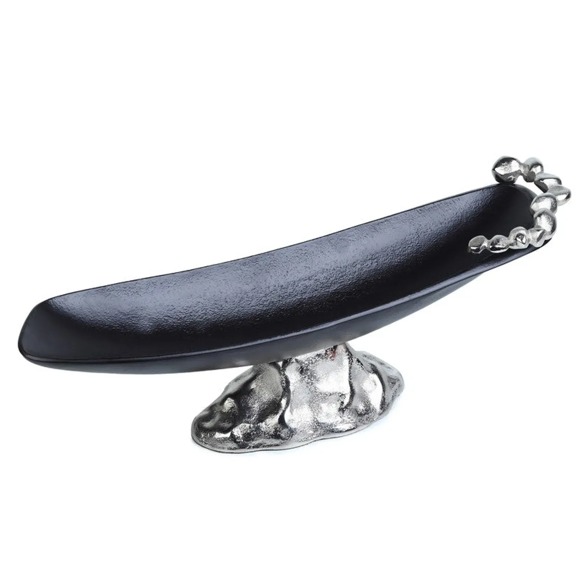 Close angled view of the elongated black fruit bowl and textured silver base