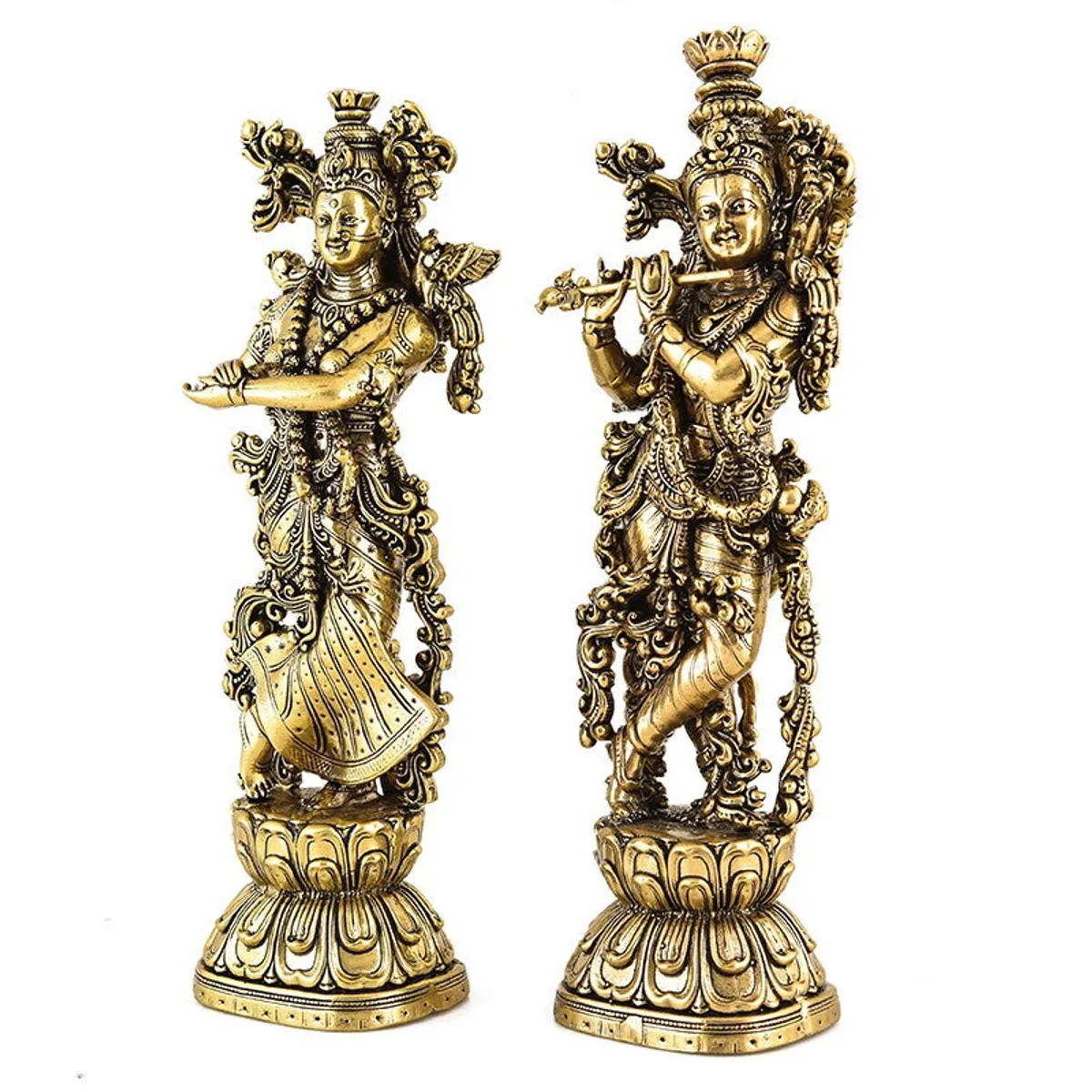 Side view of two intricately detailed gold-toned Venugopala idols