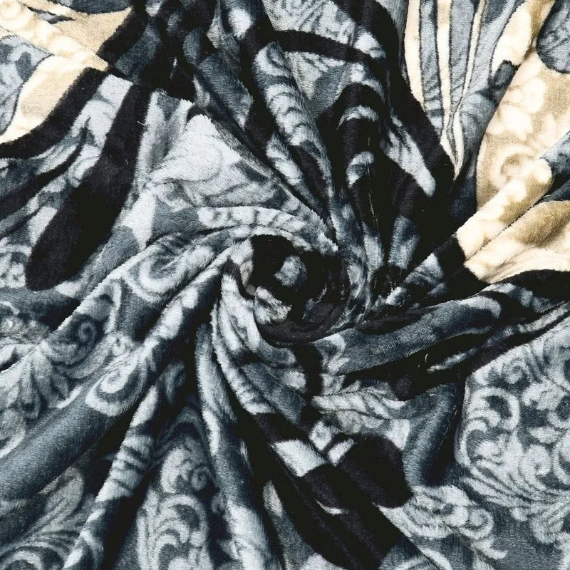 Close-up of plush black, grey and beige patterned bedsheet fabric