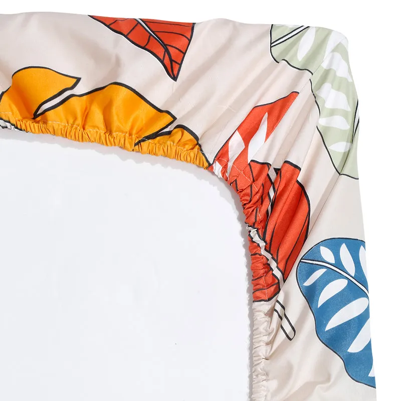 Corner view of fitted bedsheet with elastic edge and leaf print
