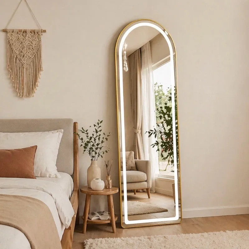 Gold full-length arched mirror with LED border in a neutral bedroom