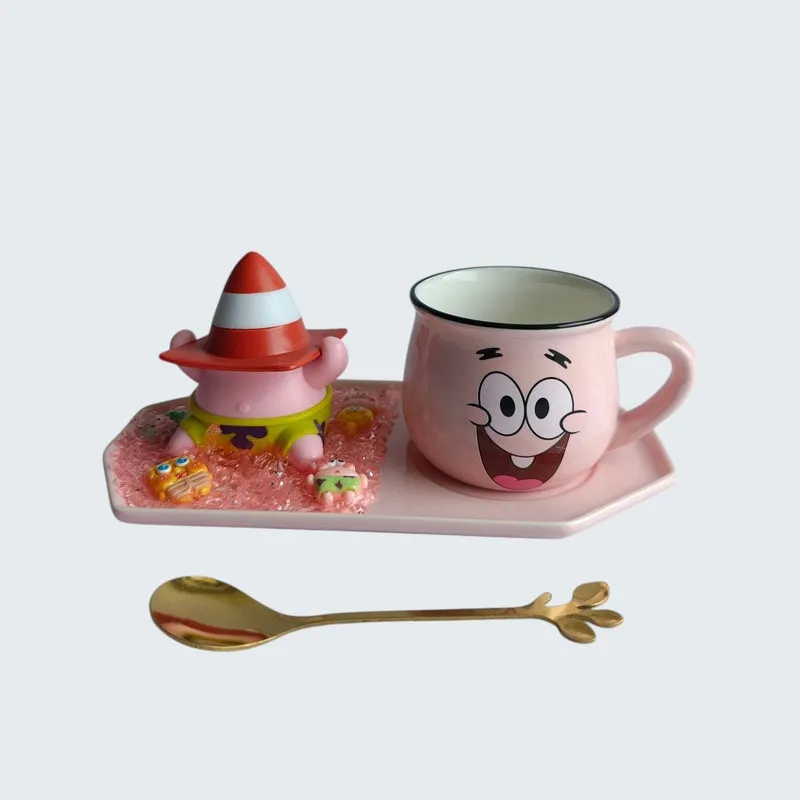 Ceramic character mug, spoon and figurine tray shown against a light background