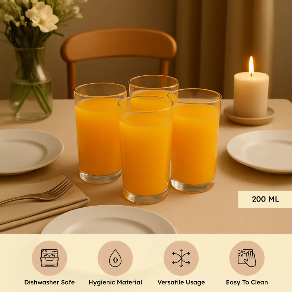 Set of four clear highball glasses with orange juice on a table
