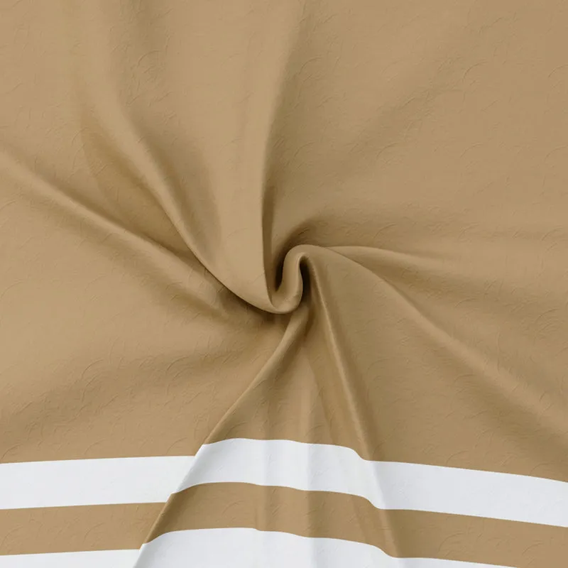 Close-up of tan fabric with white stripe detail