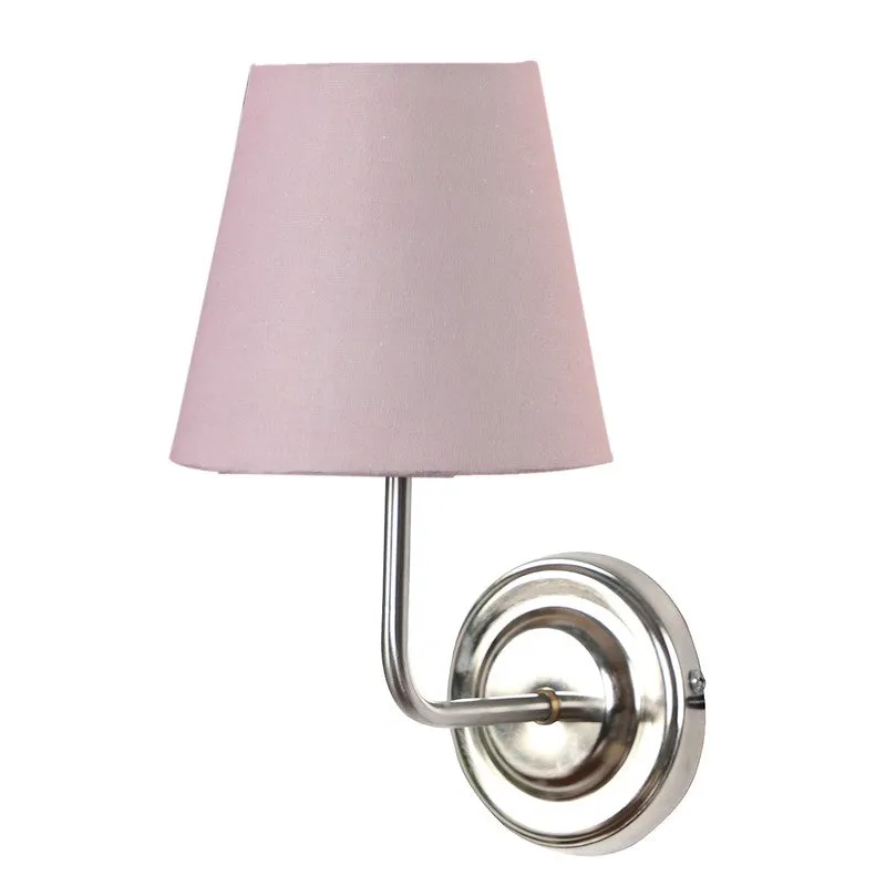 Front view of dusty pink wall lamp with round steel base