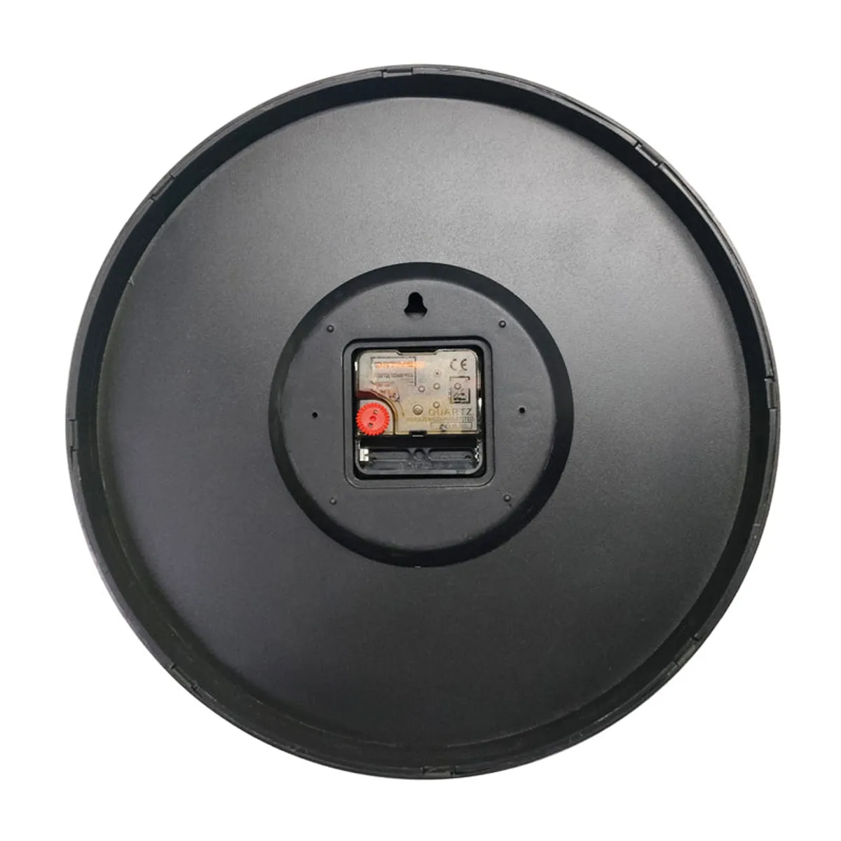 Back view of the round wall clock showing its black plastic casing and battery compartment