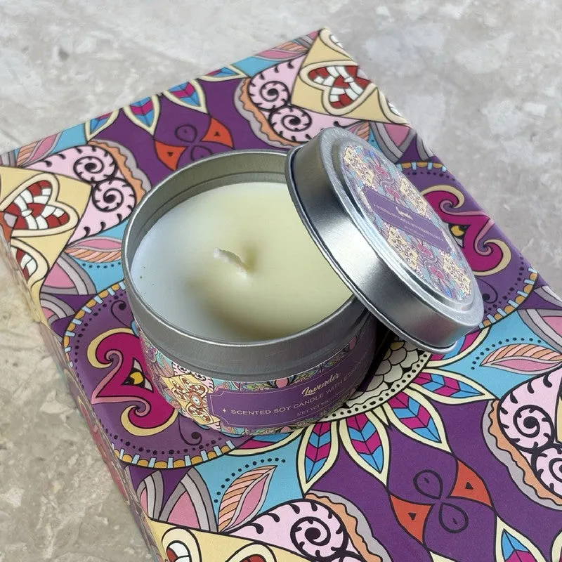 Open scented candle tin showing pale wax on a colourful patterned surface