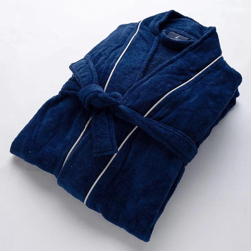 Folded navy blue bath robe with white piping