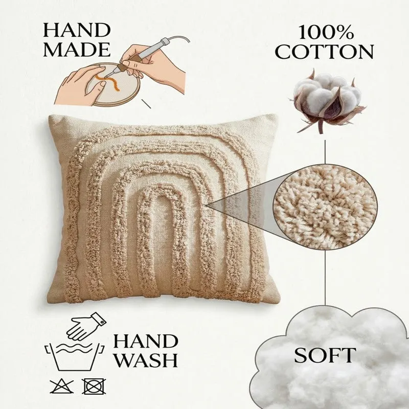 Close view of an off-white tufted cushion cover showing its raised textured surface.
