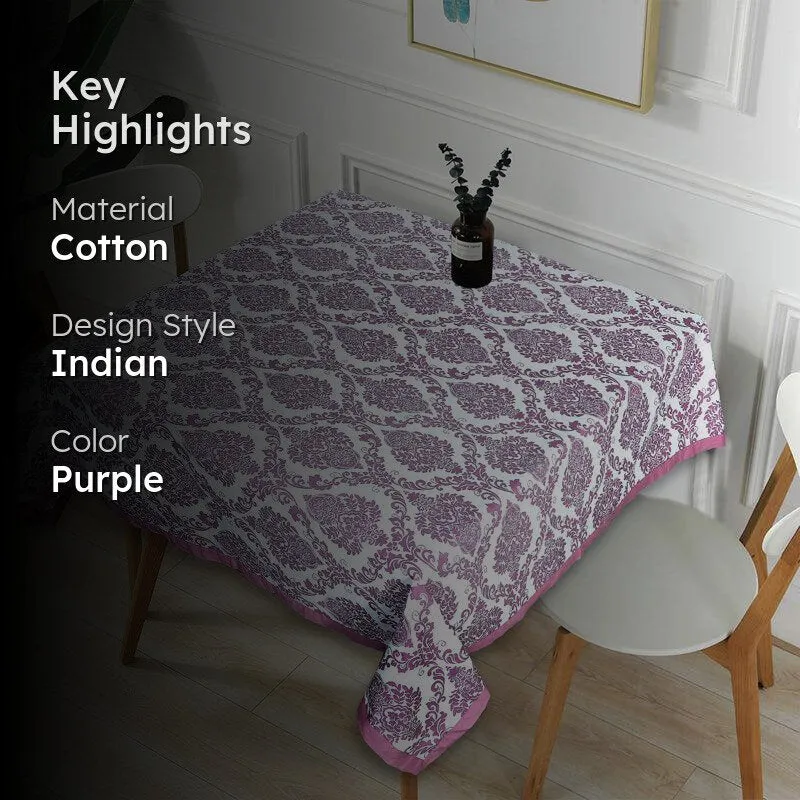 Purple and white patterned table cover styled on a dining table