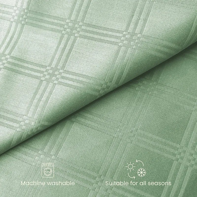 Close-up of sage green checked cotton fabric texture