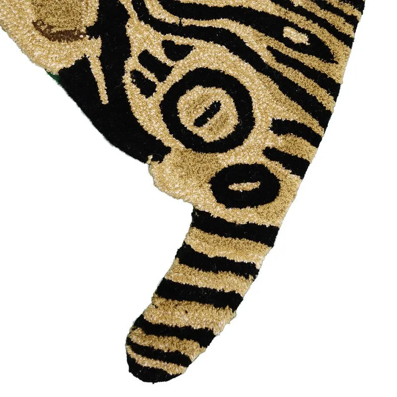 Close-up of the carpet tail with black stripes on a golden base