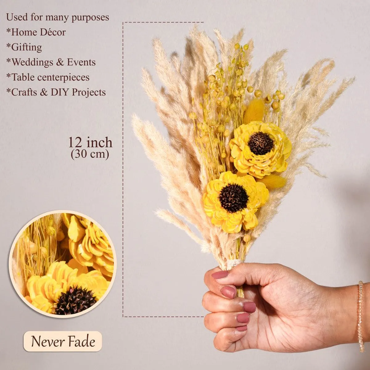 Yellow dried flower bunch held upright against a light background