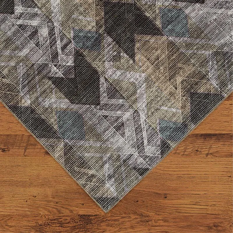 Close-up of the carpet corner showing geometric pattern and surface texture