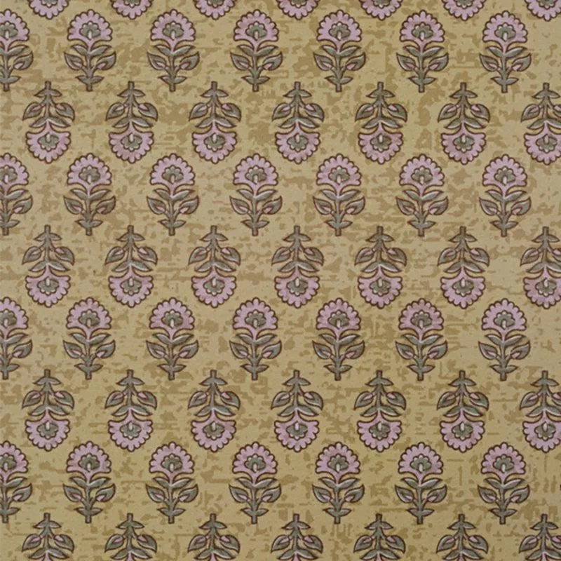 Close-up of the carpet's floral ethnic motif in beige, green and pink tones