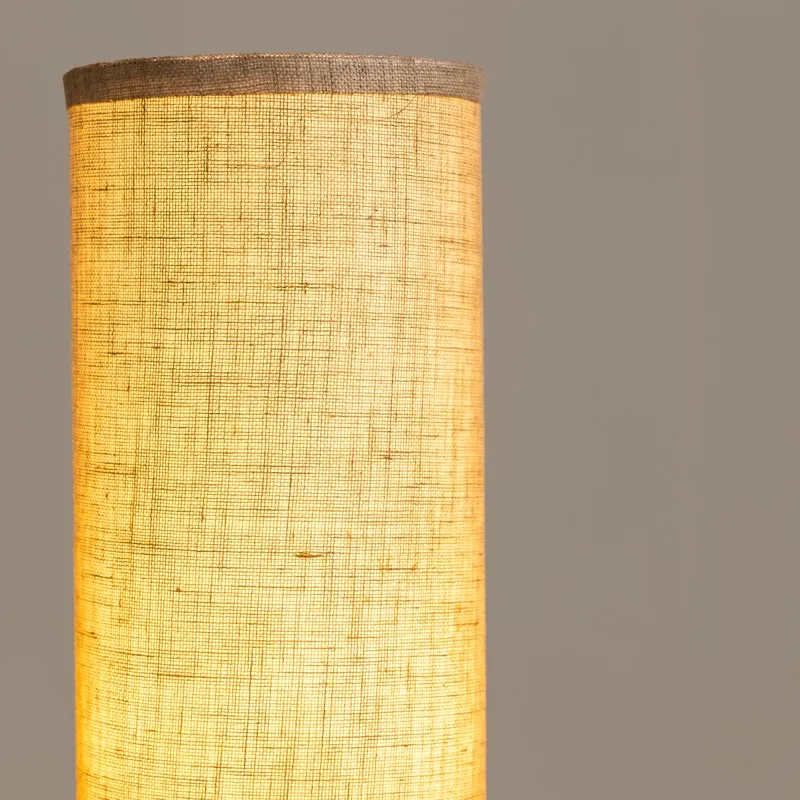 Close-up of the glowing textured beige lamp shade