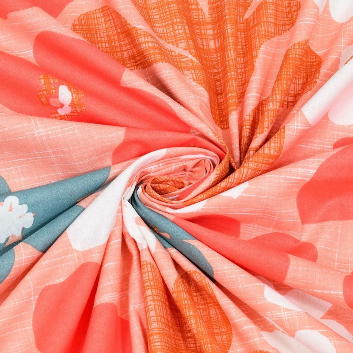 Close-up of the coral, orange, white and teal printed cotton fabric.