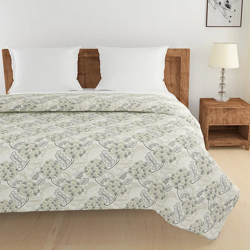 Front view of floral comforter spread across a double bed