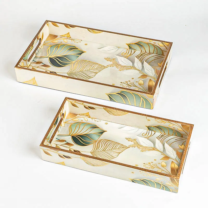 Two enamel-finish rectangular trays with botanical print on white base