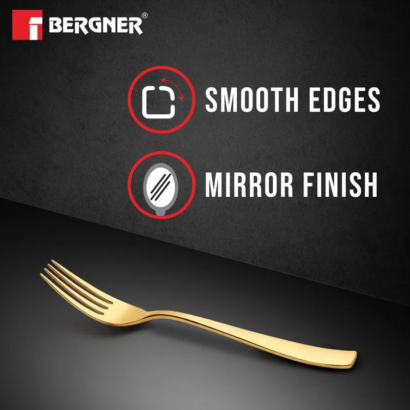 Single gold fork displayed against a dark background