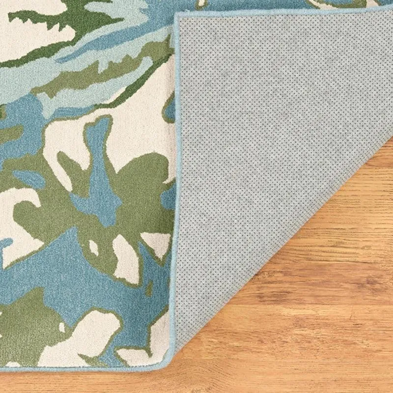 Folded carpet corner showing backing and patterned front