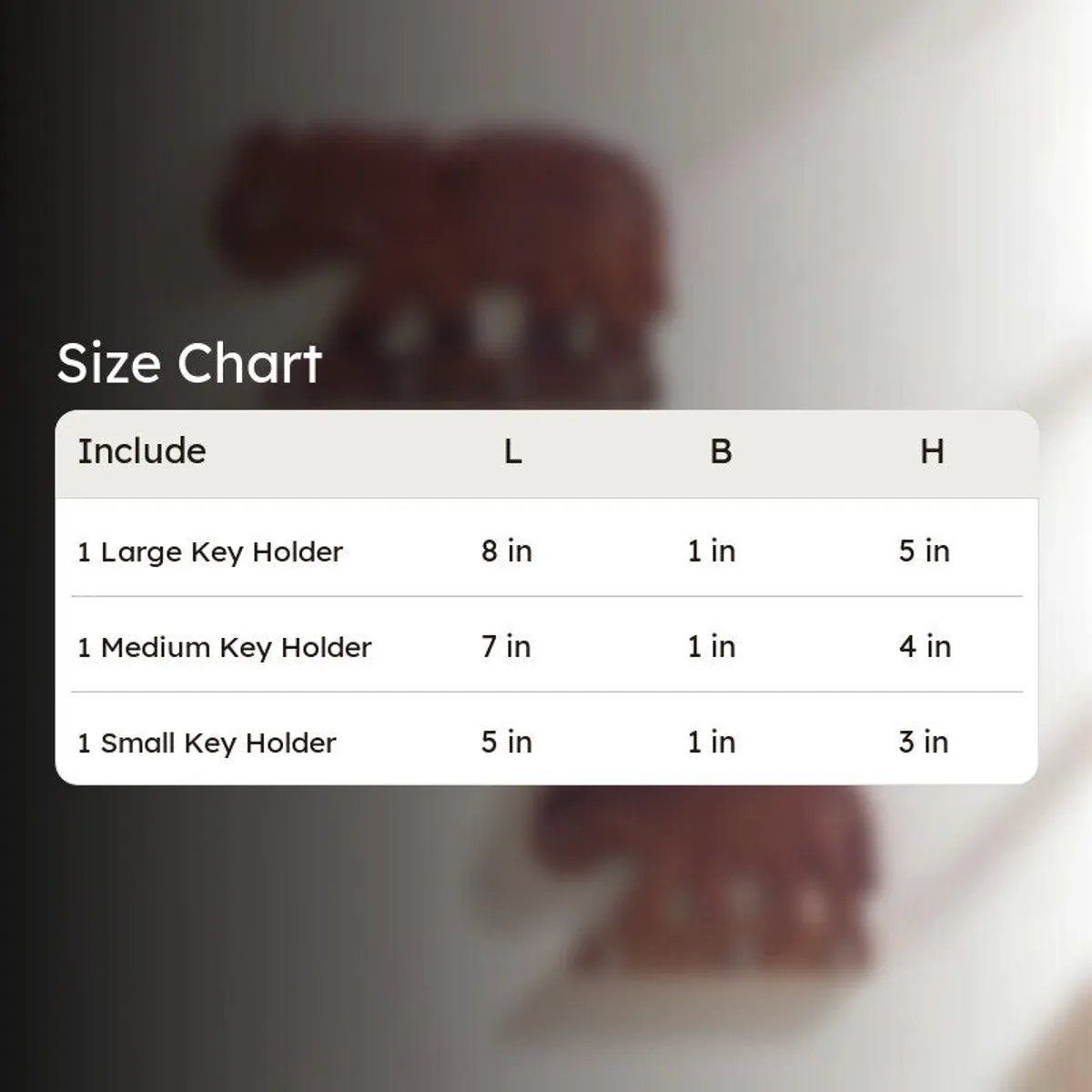 Three elephant key holders shown together in a product size comparison