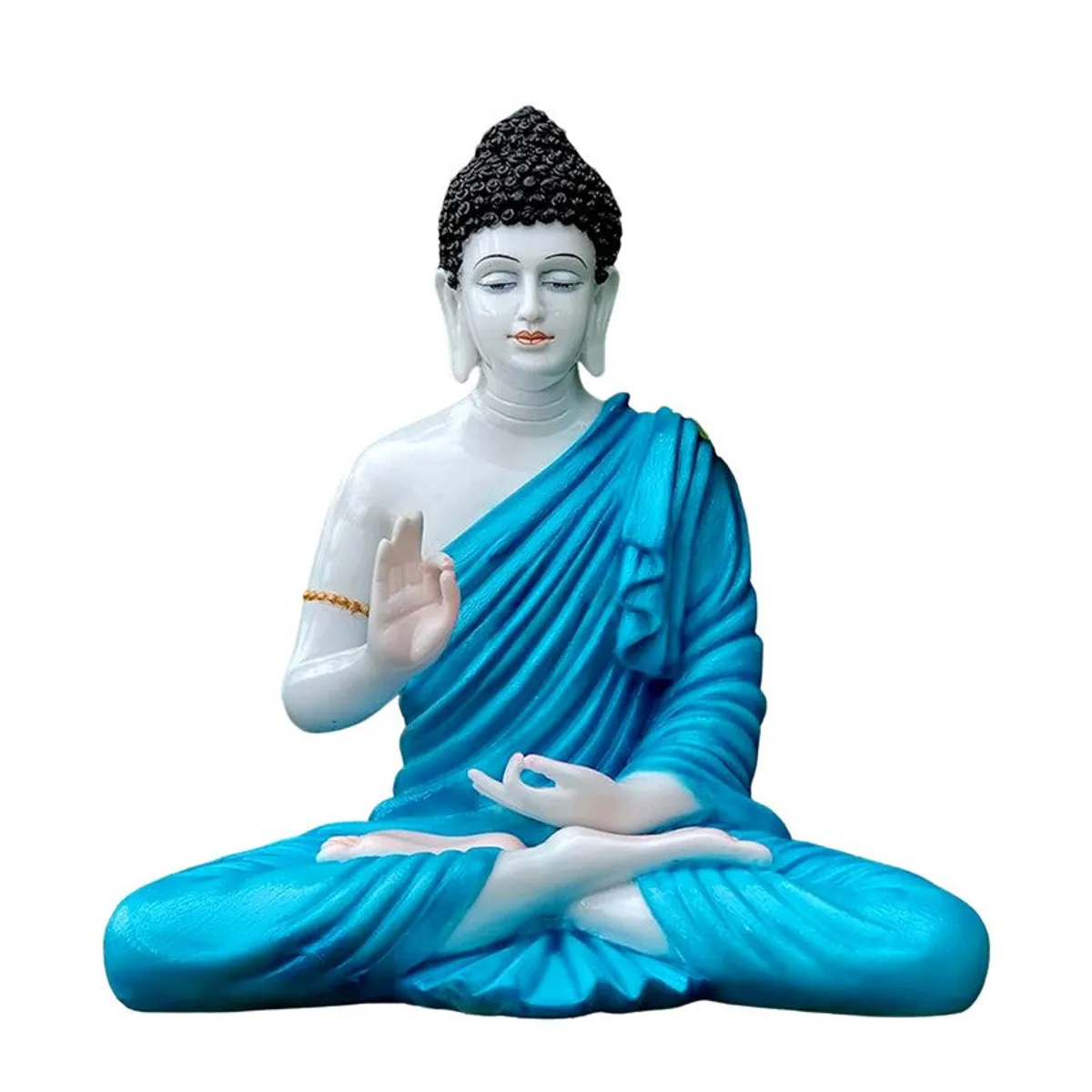 Blue and white meditating Buddha idol isolated against a white background