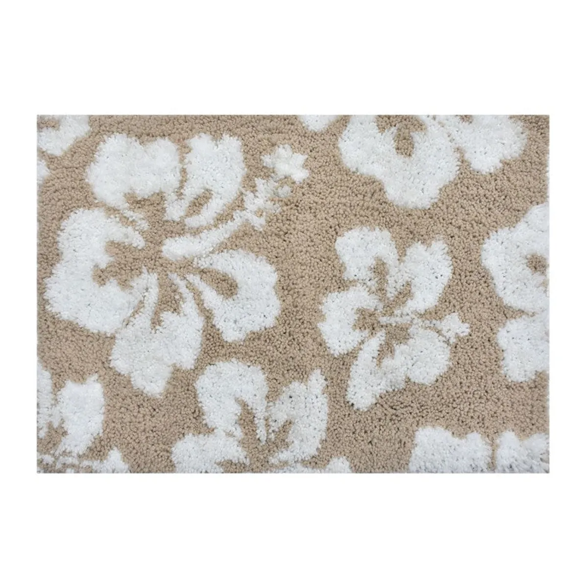 Close-up view of the bath mat's beige and white floral surface