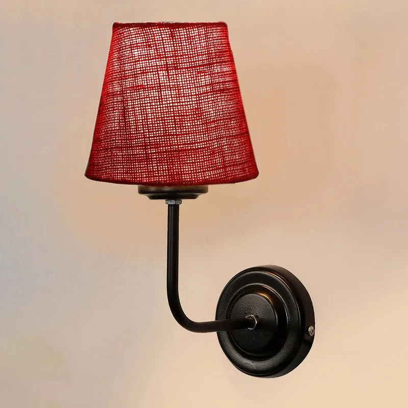 Front view of red jute wall lamp with black iron base