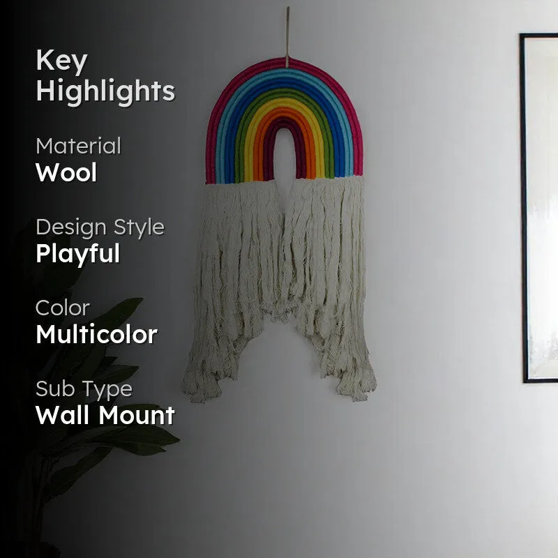 Rainbow wool wall accent displayed on a white wall beside a plant