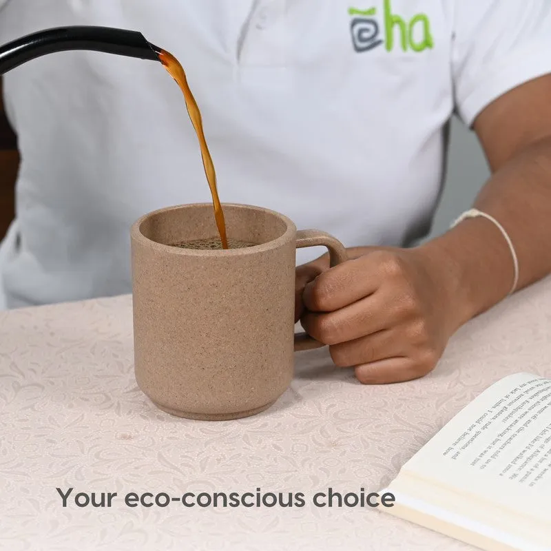 Brown mug being filled with coffee beside an open book