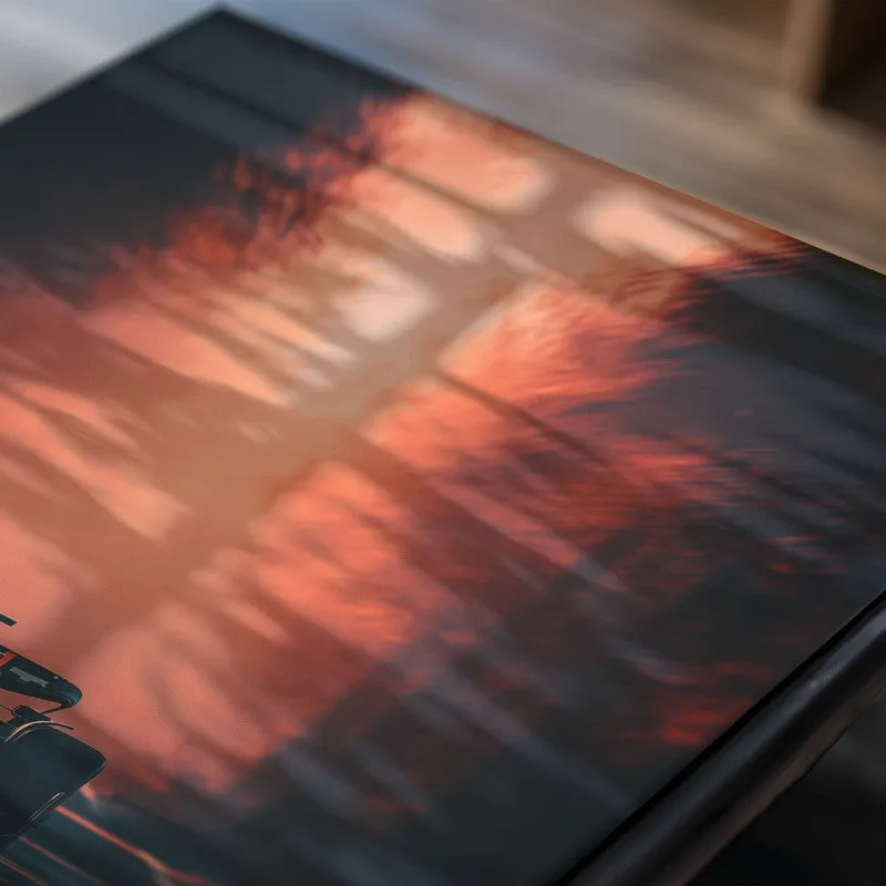 Close-up of poster with racing car and fiery background