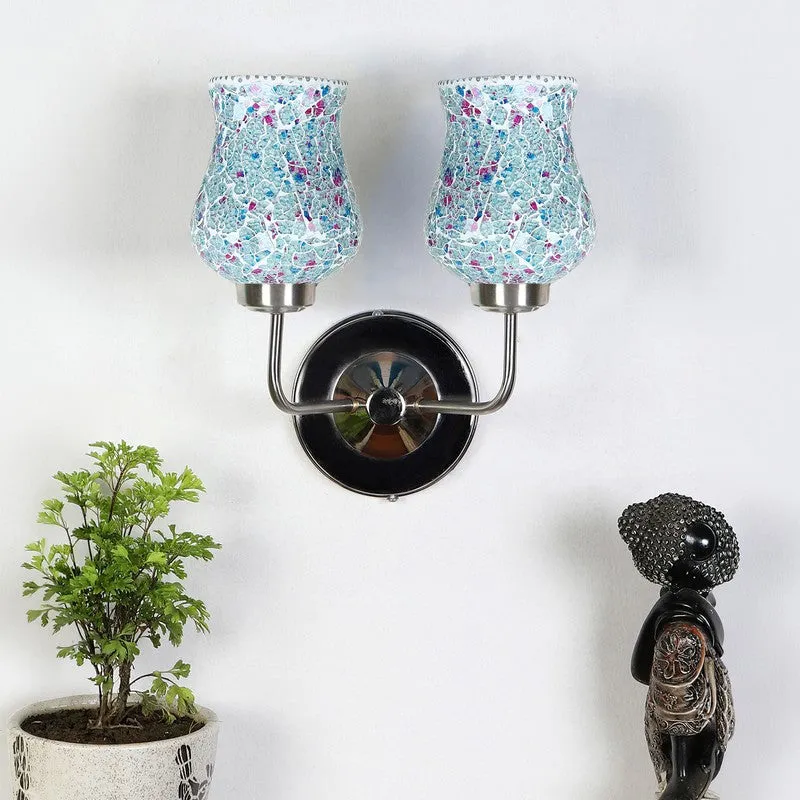 Blue crackle glass double wall lamp with steel base on a white wall