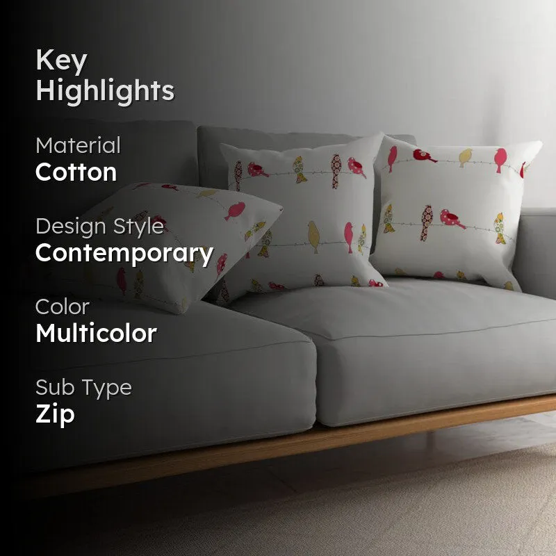Three bird-print cushion covers on a grey sofa with a dark overlay panel