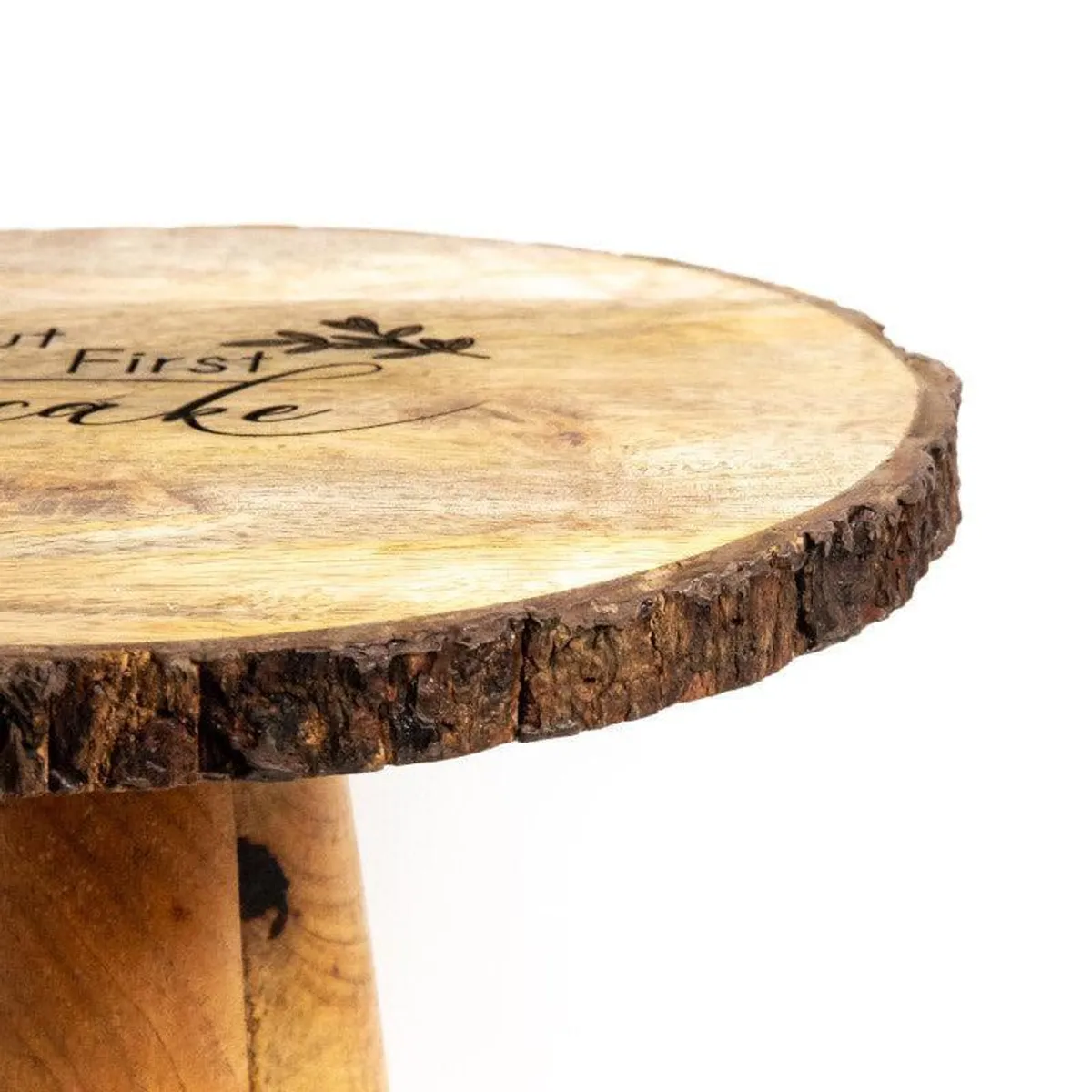 Close-up of the brown mango wood cake stand with a textured natural edge