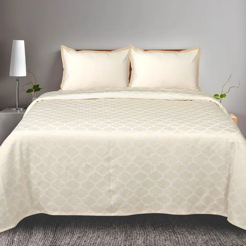 Front view of ivory geometric bedsheet with matching pillow covers