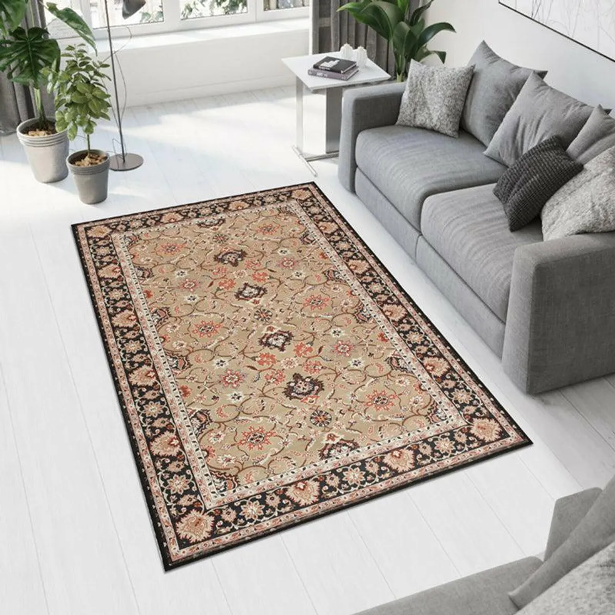 Beige and black rectangular carpet with ornate floral pattern placed beside a grey sofa