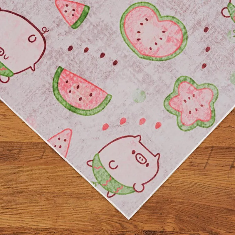Close-up of carpet corner with pig and watermelon print