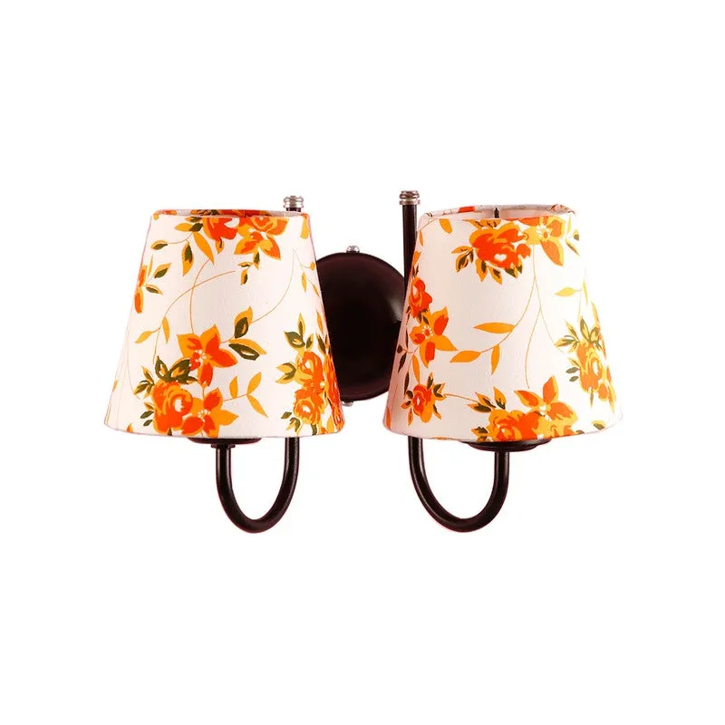 Orange and white floral wall lamp with twin shades on a white background